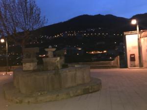 a monument with a view of a city at night at Hotel Bonadies in Ravello