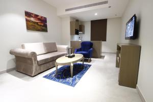 A seating area at Diwan Residence Hotel- ِAlnaeem