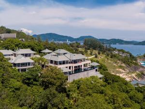 an aerial view of a large house on a hill at Baan Paa Talee Estate - SHA Extra Plus in Kamala Beach