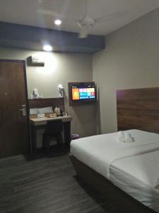Postel nebo postele na pokoji v ubytování Qing yun resthouse Bandar, Brunei Darussalam