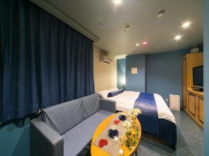 Grand Hotel Staymore -Adult Only客房内的一张或多张床位