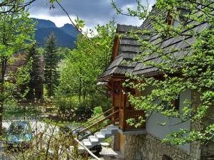 a house with a staircase leading up to a building at Willa Pod Giewontem in Zakopane