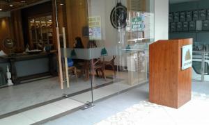 a display case in a store with a table and chairs at Cedar Peak Condominium in Baguio