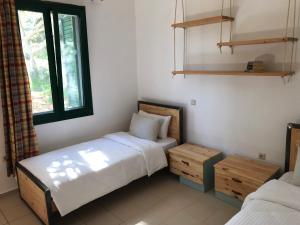 Postel nebo postele na pokoji v ubytování Temenia House