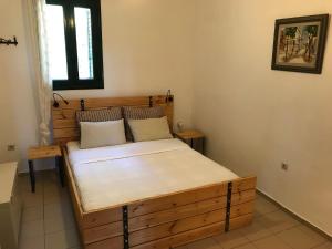 Postel nebo postele na pokoji v ubytování Temenia House
