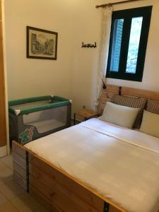 Postel nebo postele na pokoji v ubytování Temenia House
