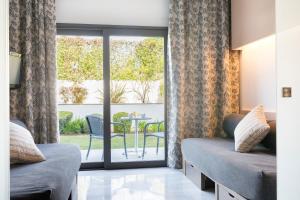 a hotel room with a bed and a window at Hipotels Gran Conil & Spa in Conil de la Frontera