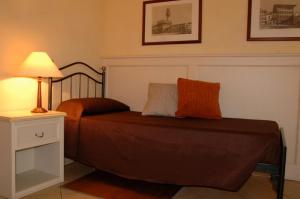 Postel nebo postele na pokoji v ubytování Hotel Relais Modica