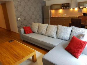 a living room with a couch and a table at Superior Apartment near the city center in Tartu