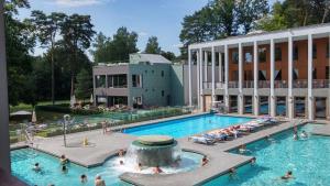 a pool at a hotel with people in the water at Seeblick III in Bad Saarow
