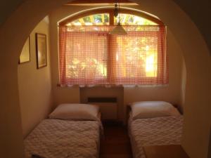 Postel nebo postele na pokoji v ubytování Vila Živohošť