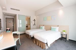 Postel nebo postele na pokoji v ubytování Hotel Liyaou