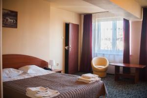 Posteľ alebo postele v izbe v ubytovaní Hotel Horyzont + 37 fotografií