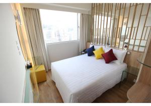 Letto o letti in una camera di IW Hotel