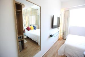 Letto o letti in una camera di IW Hotel