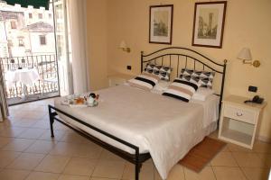 Postel nebo postele na pokoji v ubytování Hotel Relais Modica