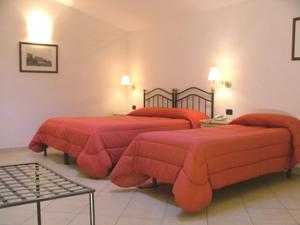 Postel nebo postele na pokoji v ubytování Hotel Relais Modica