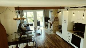 a living room with a couch and a fireplace at Villa Diamond in Žrnovnica