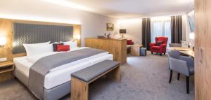 Ένα ή περισσότερα κρεβάτια σε δωμάτιο στο Genusshotel "Zum Wendl"