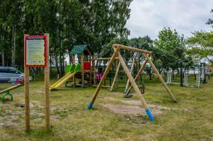 a park with a playground with a slide at OW Posejdon Jastarnia - blisko morza i nad zatoką in Jastarnia