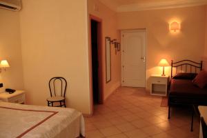Postel nebo postele na pokoji v ubytování Hotel Relais Modica