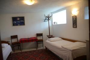 En eller flere senge i et værelse på Villa Panorama