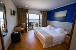 Postel nebo postele na pokoji v ubytování Hotel Don Pepe