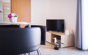 TV a/nebo společenská místnost v ubytování Apartmani J&P