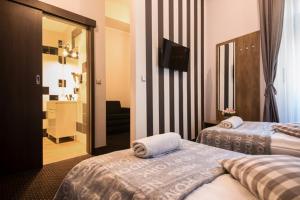 Posteľ alebo postele v izbe v ubytovaní Boogie ApartHouse Old Town