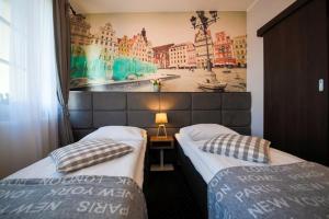 Posteľ alebo postele v izbe v ubytovaní Boogie ApartHouse Old Town