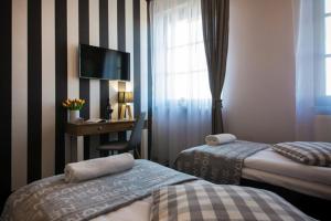 Posteľ alebo postele v izbe v ubytovaní Boogie ApartHouse Old Town