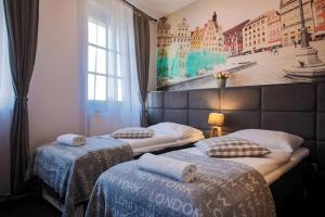 Posteľ alebo postele v izbe v ubytovaní Boogie ApartHouse Old Town