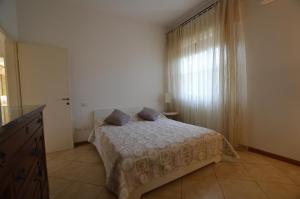 a bedroom with a bed with two pillows on it at Casa di Franca in Camaiore