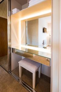 a dressing room with a bench and a mirror at Riverside Retreat - Durham in Durham +41 photos