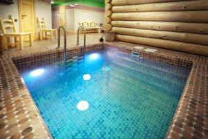 a swimming pool in the middle of a room at Boutique Hotel Traditional in Astana