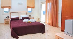 A bed or beds in a room at Sea View Resorts & Spa