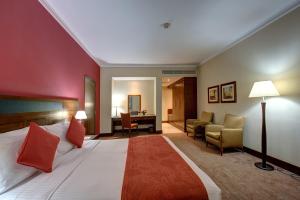 Postel nebo postele na pokoji v ubytování J5 RIMAL Hotel Apartments