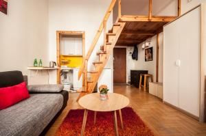 a living room with a couch and a table at Elegant Apartment Royal Castle in Warsaw