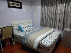 Letto o letti in una camera di 永春棧Kozzy Apartment