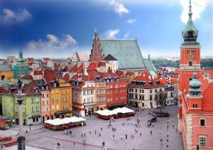 a view of a city with a clock tower at Elegant Apartment Royal Castle in Warsaw