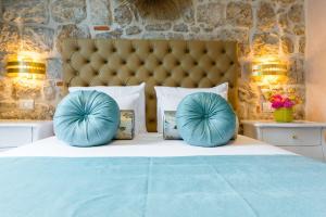 Postel nebo postele na pokoji v ubytování Dominus Rooms + 12 fotografií