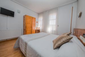 Postel nebo postele na pokoji v ubytování Alvi