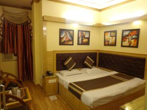 Postel nebo postele na pokoji v ubytování Hotel Lal's Haveli