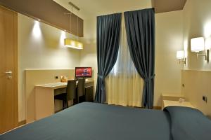Postelja oz. postelje v sobi nastanitve Sam Hotel