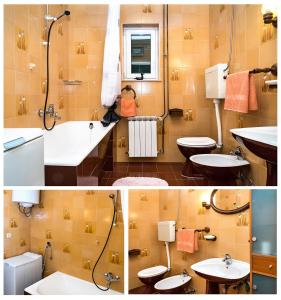 a bathroom with two sinks and a shower at Apartmani AMI in Podstrana +19 photos