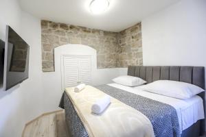 Postel nebo postele na pokoji v ubytování Villa Kate