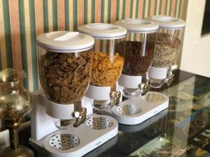 a group of four food processors sitting on a counter at Chad Hill Hotel in Sandown