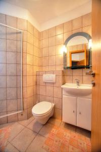 a bathroom with a toilet and a sink at Villa D&I in Srima +16 photos