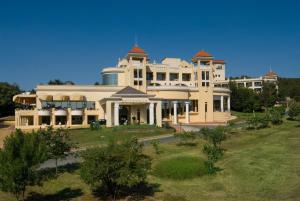 a large white building with a tower on top of it at Duni Belleville - All Inclusive in Sozopol