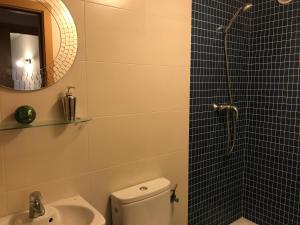 a bathroom with a shower and a toilet and a sink at Paradise Village in Salou +17 photos